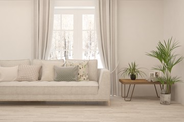 Fototapeta premium Stylowy pokój w kolorze białym z sofą i zimowym krajobrazem w oknie. Skandynawski wystrój wnętrz. Ilustracja 3D