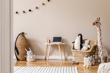 Stylish scandinavian interior of child room with natural toys, hanging decoration, design furniture, plush animals, teddy bears and accessories. Beige walls. Interior design of kid room. Template. - obrazy, fototapety, plakaty