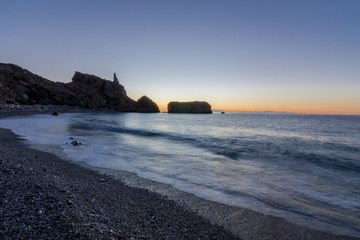 sunset on coast of sea