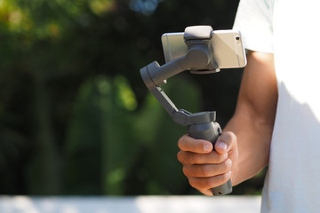 Mobile Smartphone Gimbal in the man hand.