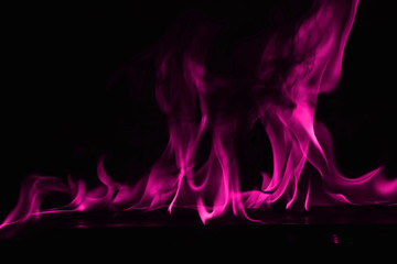 Beautiful fire pink flames on a black background.