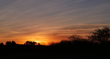 Fototapeta na wymiar Winter sunset across west country moorland