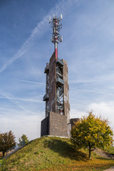Obraz premium Romanka Lookout Tower is located near village Hruby Jesenik in the district Nymburk in the Central Region. Czech republic. Is is also antenna transmitter. Nice autumn colorful scene with blue sky.