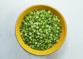 Dried green peas in a bowl.