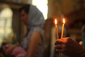 orthodox church, baptism of a child, burning candles