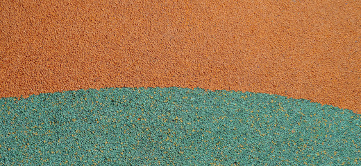 Rough orange and emerald surface close-up, background