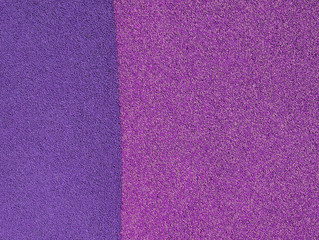 Fototapeta premium Rough surface of bright violet, purple colors close-up, background