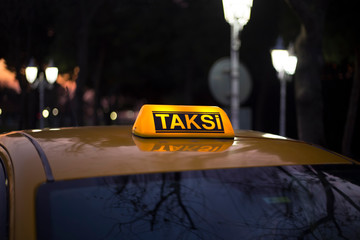 yellow taxi waiting for passengers in the evening