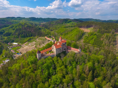 Aerial view of Moravian castle Pernstejn, standing on a hill above deep forests of the Bohemian-Moravian Highlands in Czech Republic