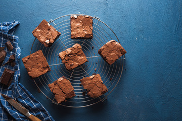 Brownies cake squares on cooling rack. Chocolate fudge brownies