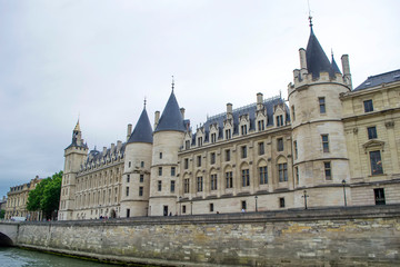 Fototapeta na wymiar Conciergerie - former royal castle and prison in the center of Paris. Conciergerie Castle is part of the Palace of Justice complex.