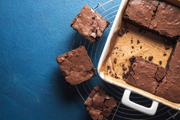 Brownies in a pan and on a cooling tray. Homemade brownies