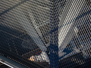 Galvanized grating for movement on a gantry crane on a sunny day.