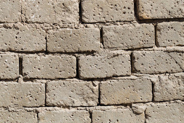 Wall with rough brickwork. Bedouin house wall in african desert.