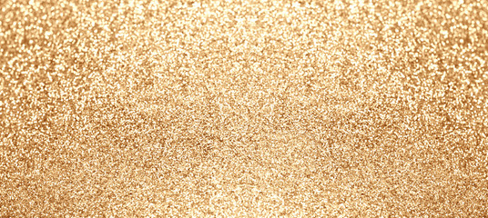 Abstract gold shiny glitter sparkle background. Holiday golden lights
