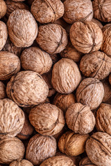 walnuts, unpeeled greek nuts, harvest of walnuts, walnuts closeup, background with walnuts,organic delicious nuts. healthy snack.