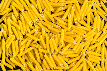 Background of A pile of penne pasta
