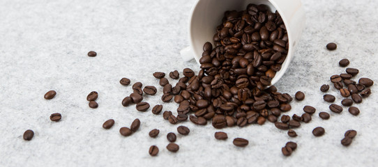 Good coffee beans in a caffe mug