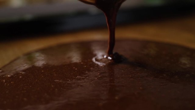 pastry chef preparing chocolate batter for cake and brownies.