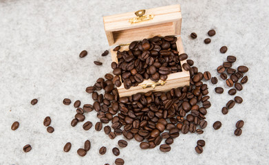 Roastedcoffe beans in a treasure chest