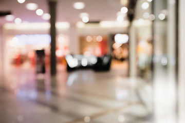 Abstract blurred and defocused background of shopping mall with bokeh. Sales concept.