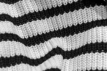 Knitted fabric, striped sweater, nautical style, loops closeup, texture, shopping concept, for background