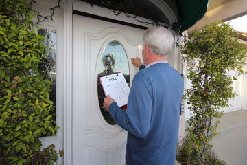 Man taking poll, door to door