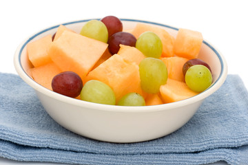 fruit bowl of cantaloupe and grapes