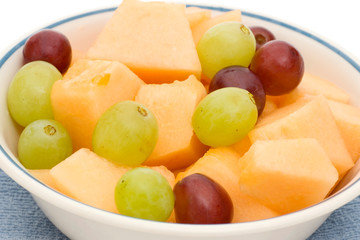 fruit bowl of cantaloupe and grapes