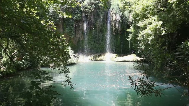 Kursunlu Falls falling in a lake with turquoise water