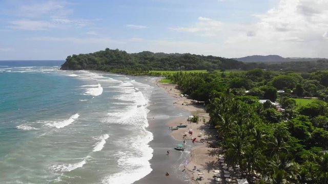 Aerial timelapse view of the coastline, flying backwards, at Samara beach, Costa Rica.