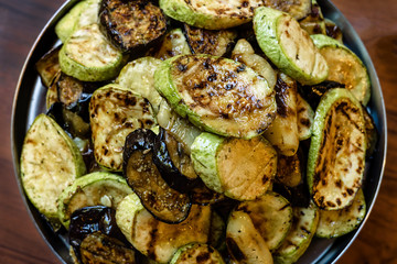 Grilled zucchini in a large bowl, beautiful and fresh.
