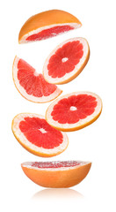 Flying cut grapefruit on white background