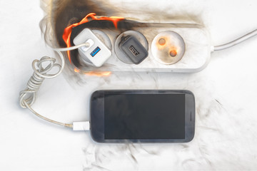 power supply burns with fire, phone on recharge, the fire in the apartment. cause of the fire counterfeit charger