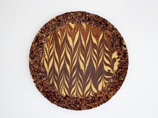 Aerial Shot of a Full Chocolate Cheesecake with a White Background