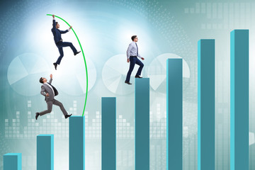 Businessman vault jumping over bar charts