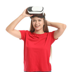Young woman with VR glasses on white background