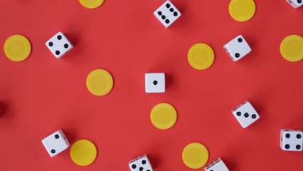 Flat Lay of Dice and Yellow Chips on a Red Background | Game Night