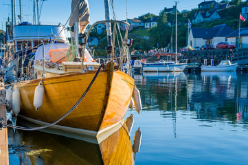 Old wooden boat in Tarbert marina. Inner Hebrides sailing trip, Scotland.