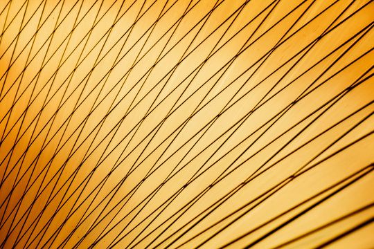 Horizontal photo of beautiful abstract gold metal background with light and shadows. Free space for design.