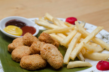 Chicken nuggets and french fries and sauces