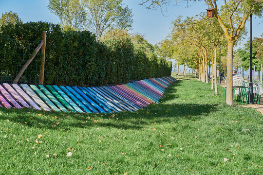 Noain park that has the beams painted in a multitude of colors like rainbows.
