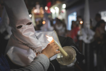 Nazarene in a procession at the holy week in Marbella