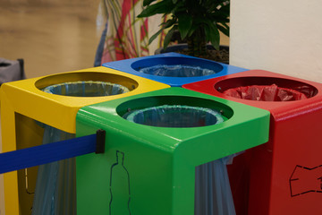 coloured waste containers to indicate the different types of recycling materials, depending on the type of waste and in yellow, blue, red and green