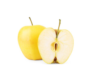 Golden variety apple whole and in a cut on a white background