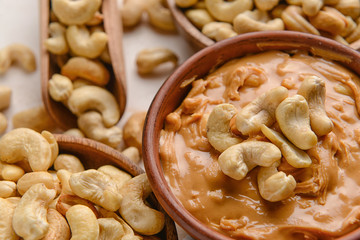 Bowl with cashew butter on table, closeup