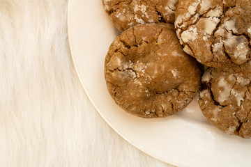 Brown cookies on a white plate