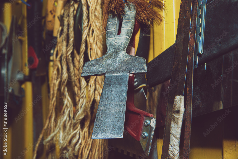 Poster a set of tools on a yellow wall. concept of work in a home workshop, doing homework. tools such as t