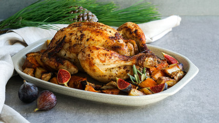 Roasted chicken with rosemary and  Sweet potato. served on grey stone, latin american food, top view