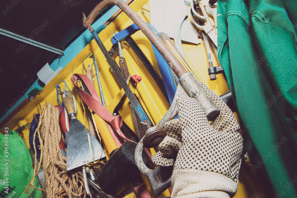 Poster a set of tools on a yellow wall. concept of work in a home workshop, doing homework. tools such as t